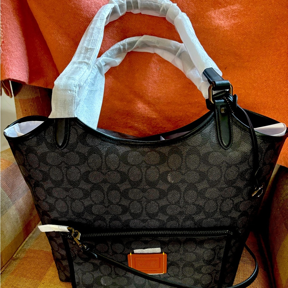 Brand New Coach Tote with small handbag. 
Gorgeous, waterproof , large inside